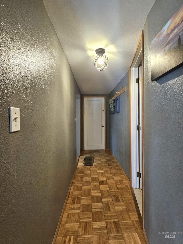 corridor with a textured wall