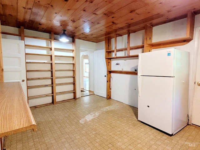 interior space featuring wooden ceiling, freestanding refrigerator, light floors, and arched walkways