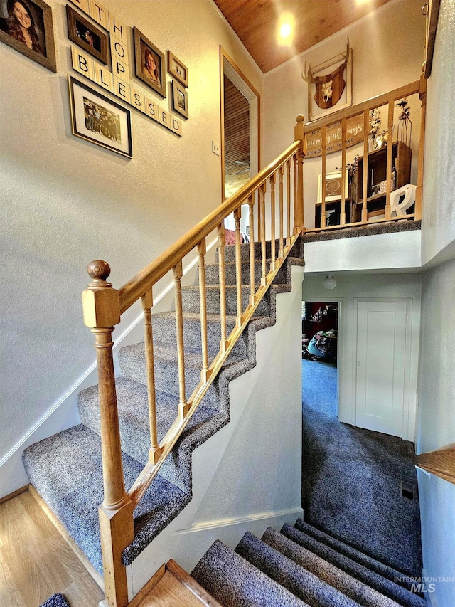 stairway featuring wood finished floors