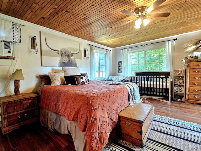 bedroom featuring crown molding, wood ceiling, a ceiling fan, and wood finished floors