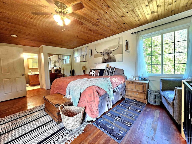 bedroom with ensuite bathroom, wood-type flooring, and wooden ceiling