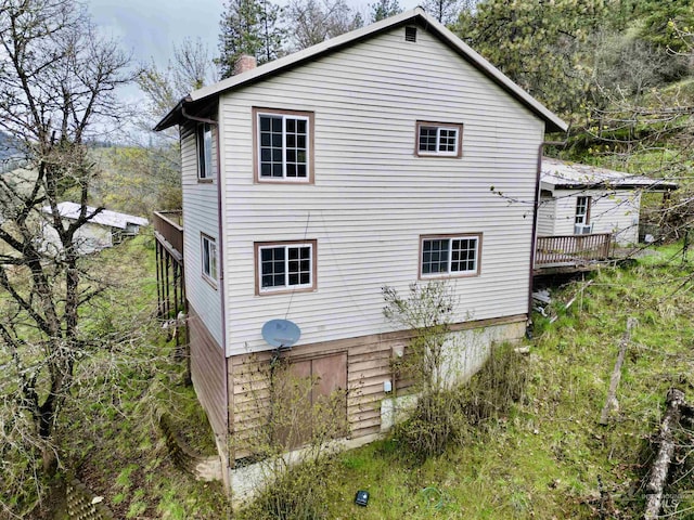 rear view of house with a deck