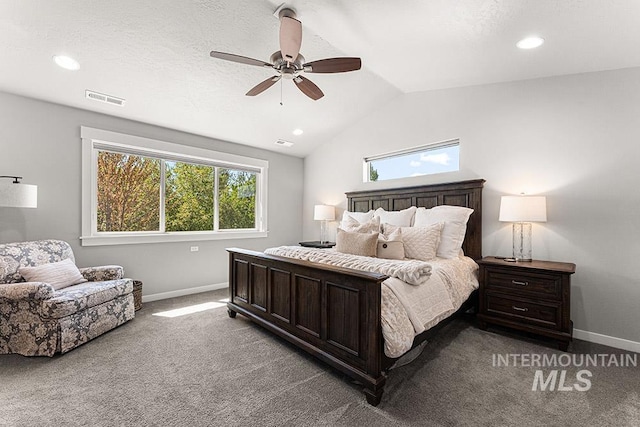bedroom featuring baseboards, visible vents, vaulted ceiling, and carpet