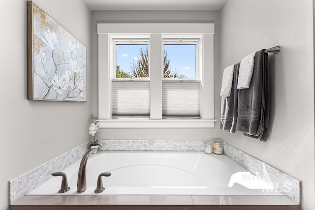 bathroom featuring a bath