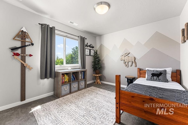carpeted bedroom featuring baseboards and visible vents