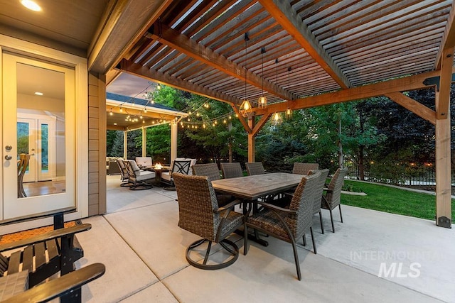 view of patio / terrace with a pergola and outdoor dining area