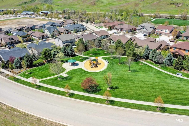 birds eye view of property with a residential view