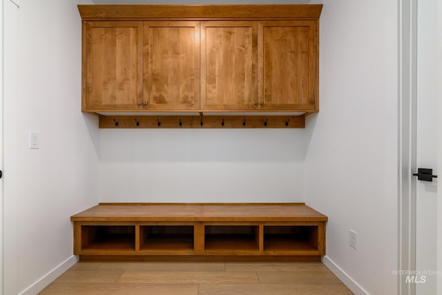 12510 W Wild Thistle Dr, Star, ID 83669 - mudroom featuring baseboards and light wood-style flooring