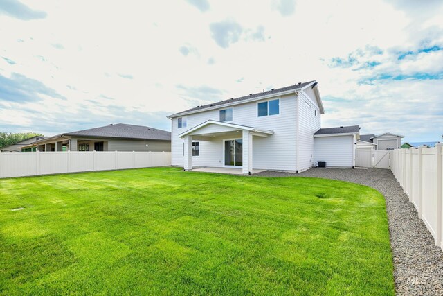 12510 W Wild Thistle Dr, Star, ID 83669 - back of house featuring a patio and a gate