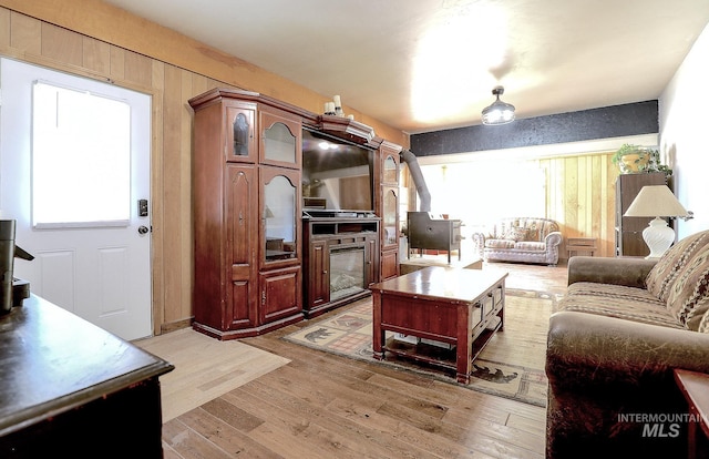 living area with plenty of natural light and light wood finished floors