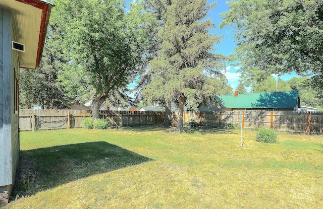 view of yard with a fenced backyard