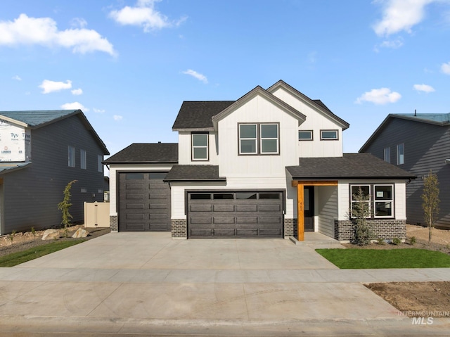461 S Quincannon Ln, Star, ID 83669 - view of front of home featuring brick siding, a shingled roof, an attached garage, and driveway