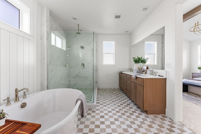 461 S Quincannon Ln, Star, ID 83669 - ensuite bathroom with a freestanding tub, a marble finish shower, a wealth of natural light, and visible vents
