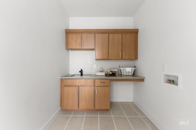 461 S Quincannon Ln, Star, ID 83669 - washroom featuring a sink, baseboards, hookup for a washing machine, and cabinet space