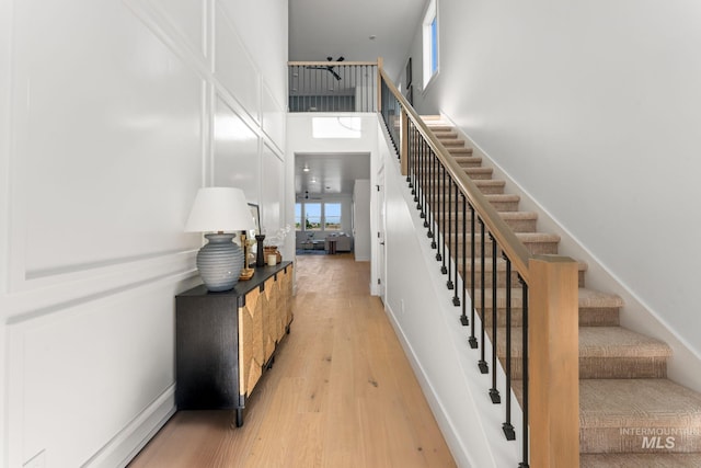 461 S Quincannon Ln, Star, ID 83669 - stairway with baseboards, wood finished floors, and a towering ceiling
