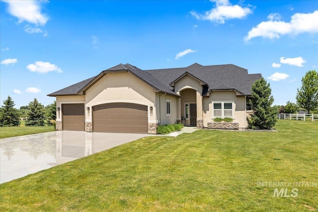9968 Moon Shadow Ct, Middleton, ID 83644 - view of front facade with stucco siding, an attached garage, stone siding, and concrete driveway