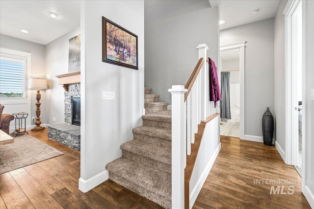 9968 Moon Shadow Ct, Middleton, ID 83644 - staircase with wood finished floors, a fireplace, and recessed lighting