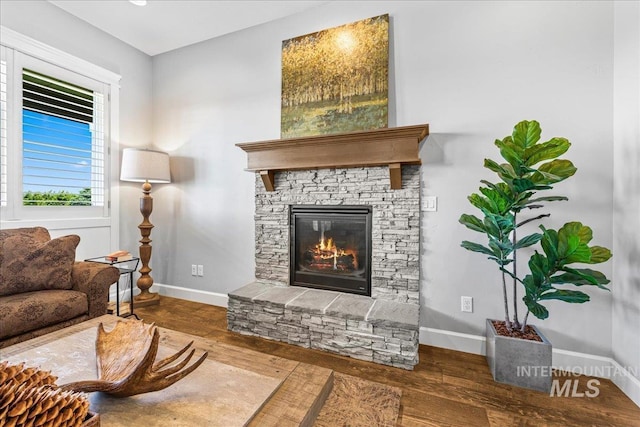 9968 Moon Shadow Ct, Middleton, ID 83644 - living area featuring a stone fireplace and wood finished floors