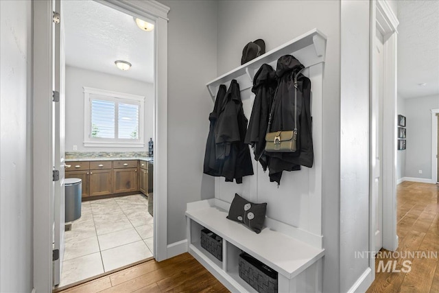 9968 Moon Shadow Ct, Middleton, ID 83644 - mudroom featuring baseboards and light wood-type flooring