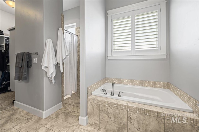 9968 Moon Shadow Ct, Middleton, ID 83644 - full bathroom with a garden tub, a walk in closet, and a stall shower
