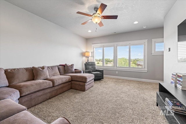 9968 Moon Shadow Ct, Middleton, ID 83644 - carpeted living room with ceiling fan, a textured ceiling, healthy amount of natural light, and recessed lighting