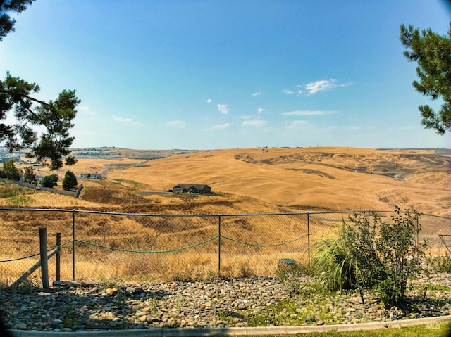 view of mountain feature with a rural view