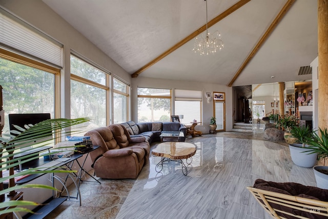 living room with beamed ceiling, a healthy amount of sunlight, high vaulted ceiling, and a chandelier