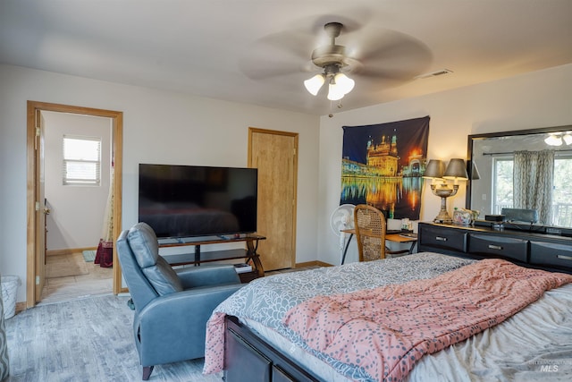 bedroom with ceiling fan and light hardwood / wood-style flooring