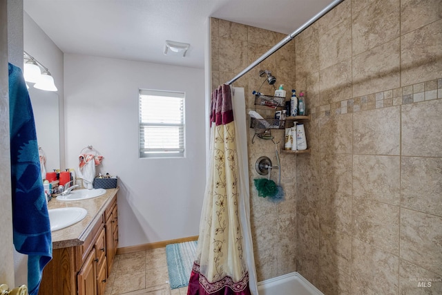 bathroom with double vanity, walk in shower, and tile patterned floors