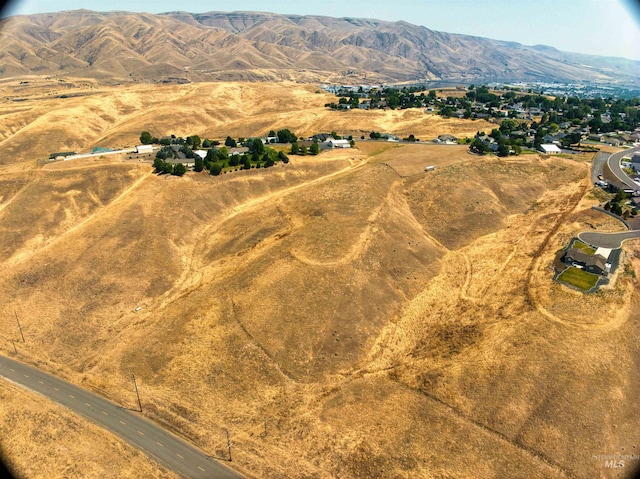 drone / aerial view featuring a mountain view