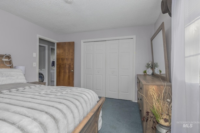455 Farber Dr, Payette, ID 83661 - bedroom featuring washer / dryer, a closet, dark carpet, and a textured ceiling