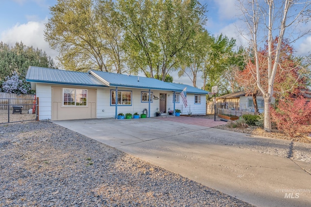 455 Farber Dr, Payette, ID 83661 - ranch-style home featuring fence, driveway, and metal roof