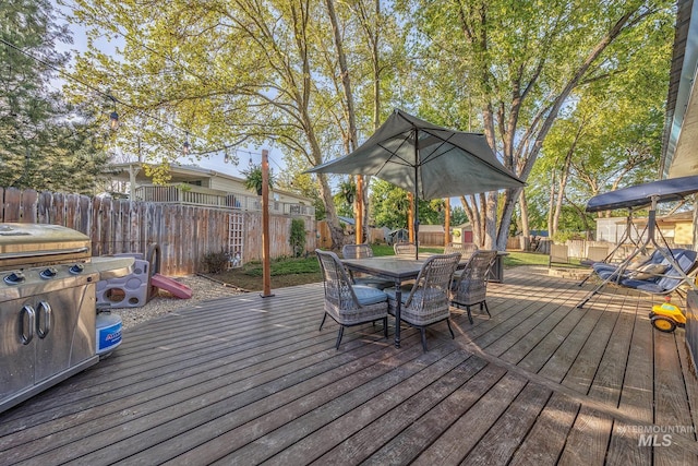 455 Farber Dr, Payette, ID 83661 - deck with a fenced backyard and outdoor dining space