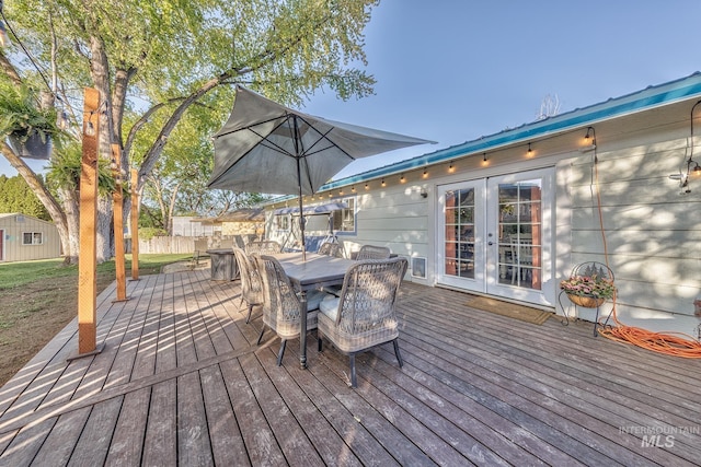 455 Farber Dr, Payette, ID 83661 - wooden terrace featuring outdoor dining area, fence, and french doors