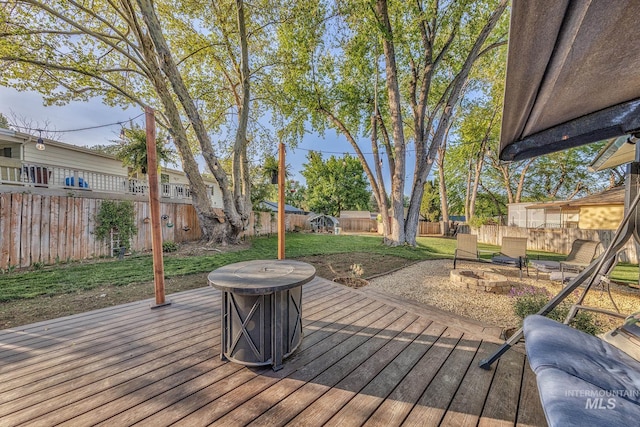 455 Farber Dr, Payette, ID 83661 - wooden terrace with a fenced backyard, an outdoor fire pit, and a yard