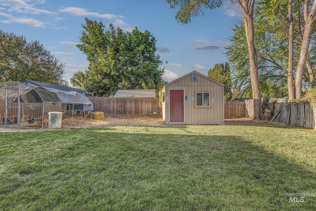 455 Farber Dr, Payette, ID 83661 - view of yard featuring a fenced backyard, exterior structure, an outdoor structure, and a storage unit