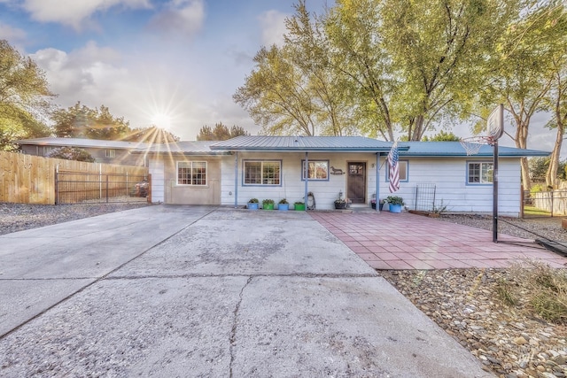455 Farber Dr, Payette, ID 83661 - back of property with fence, concrete driveway, and metal roof