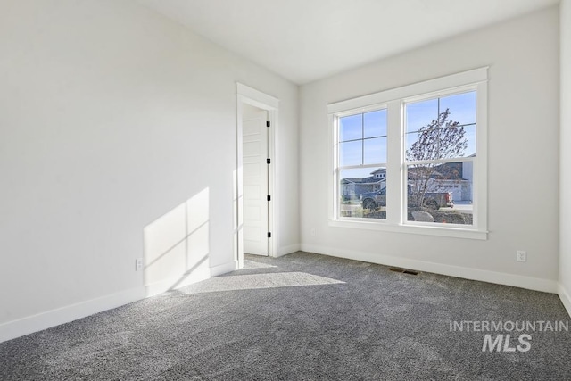 9382 Basin Kid, Middleton, ID 83644 - unfurnished room featuring baseboards and carpet flooring