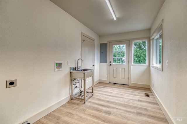 3131 Fuller Rd, Emmett, ID 83617 - laundry room featuring electric dryer hookup, washer hookup, light wood-style floors, baseboards, and electric panel