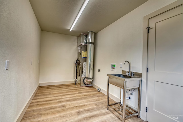 3131 Fuller Rd, Emmett, ID 83617 - basement with light wood-style floors, a textured wall, and baseboards