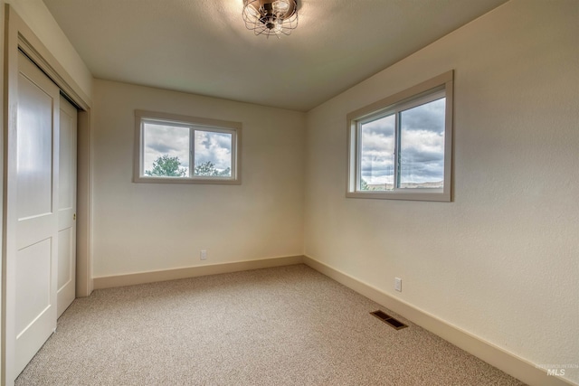 3131 Fuller Rd, Emmett, ID 83617 - unfurnished bedroom with light carpet, baseboards, and a closet
