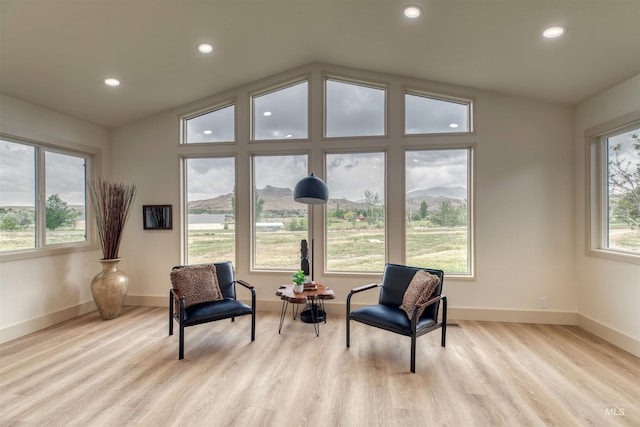 3131 Fuller Rd, Emmett, ID 83617 - living area featuring vaulted ceiling, light wood-style flooring, recessed lighting, baseboards, and a mountain view