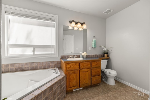 3011 S Montego Way, Nampa, ID 83686 - full bathroom featuring vanity, a bath, toilet, and baseboards