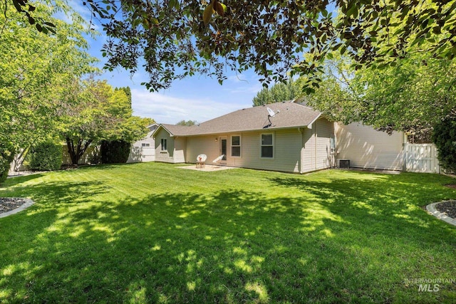 3011 S Montego Way, Nampa, ID 83686 - back of property with central AC unit and a patio