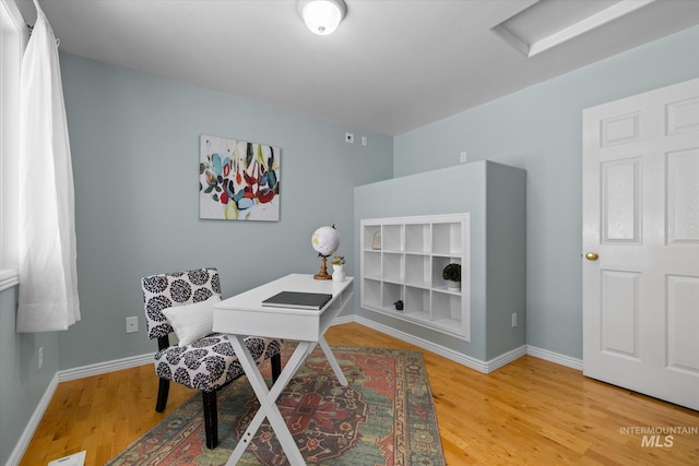 3011 S Montego Way, Nampa, ID 83686 - home office with light wood finished floors, baseboards, and attic access