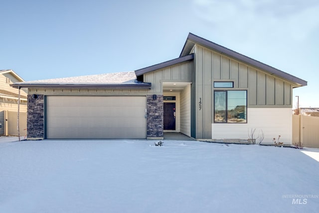 1457 W Bass River Dr, Meridian, ID 83642 - view of front of property featuring board and batten siding, a garage, and driveway