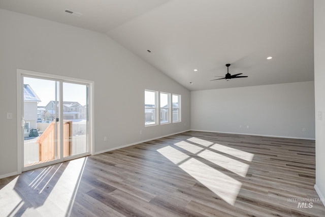1457 W Bass River Dr, Meridian, ID 83642 - empty room featuring lofted ceiling, a ceiling fan, wood finished floors, baseboards, and recessed lighting