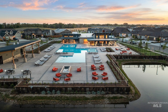 pool at dusk with a water view