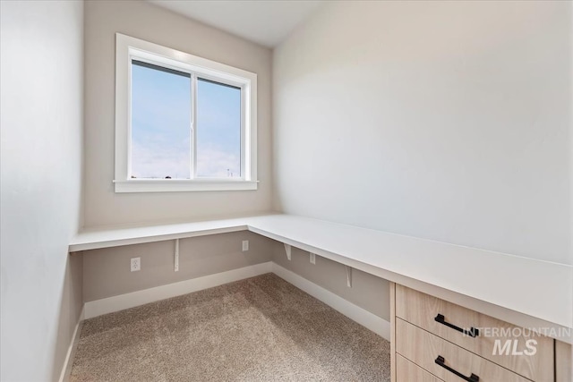 unfurnished office with light colored carpet