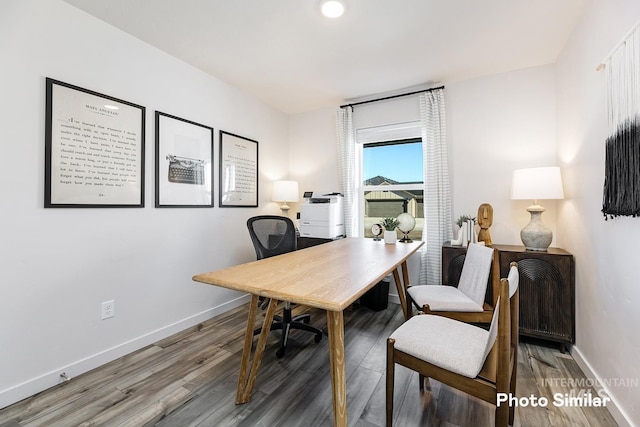 office area featuring baseboards and wood finished floors